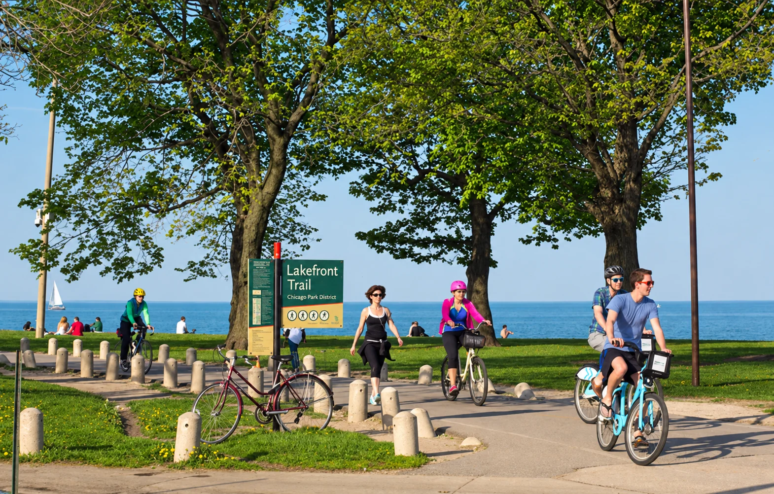 People walking and cycling beside Lake Michigan on the Lakefront Trail