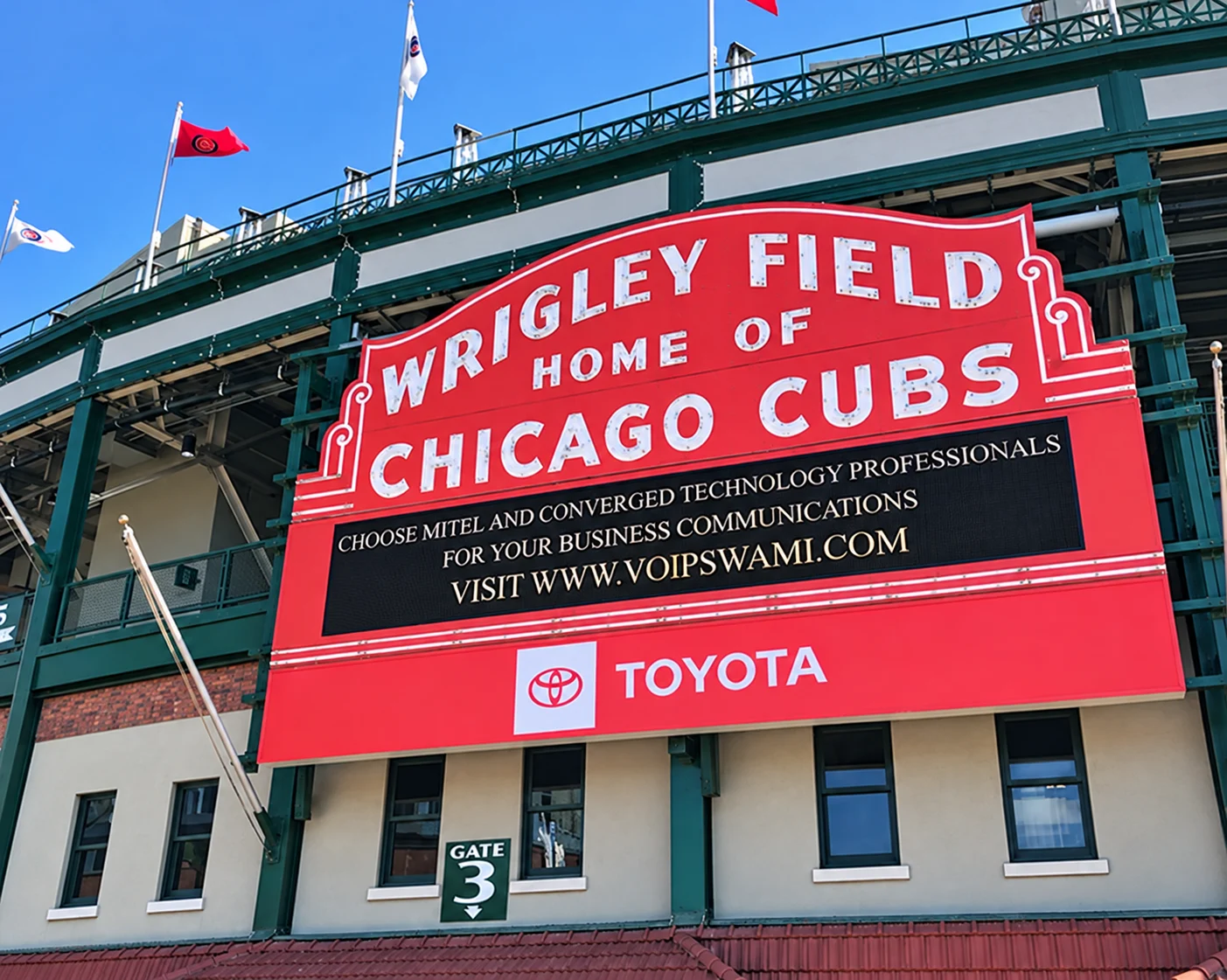 Red Wrigley Field sign above the stadium entrance